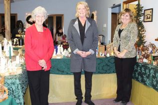 Jean Freeman, Cindy McMahon and Kris Caird welcomed visitors to the Cole Lake Free Methodist Church over the weekend for the annual 101 Nativities display. Photo/Craig Bakay